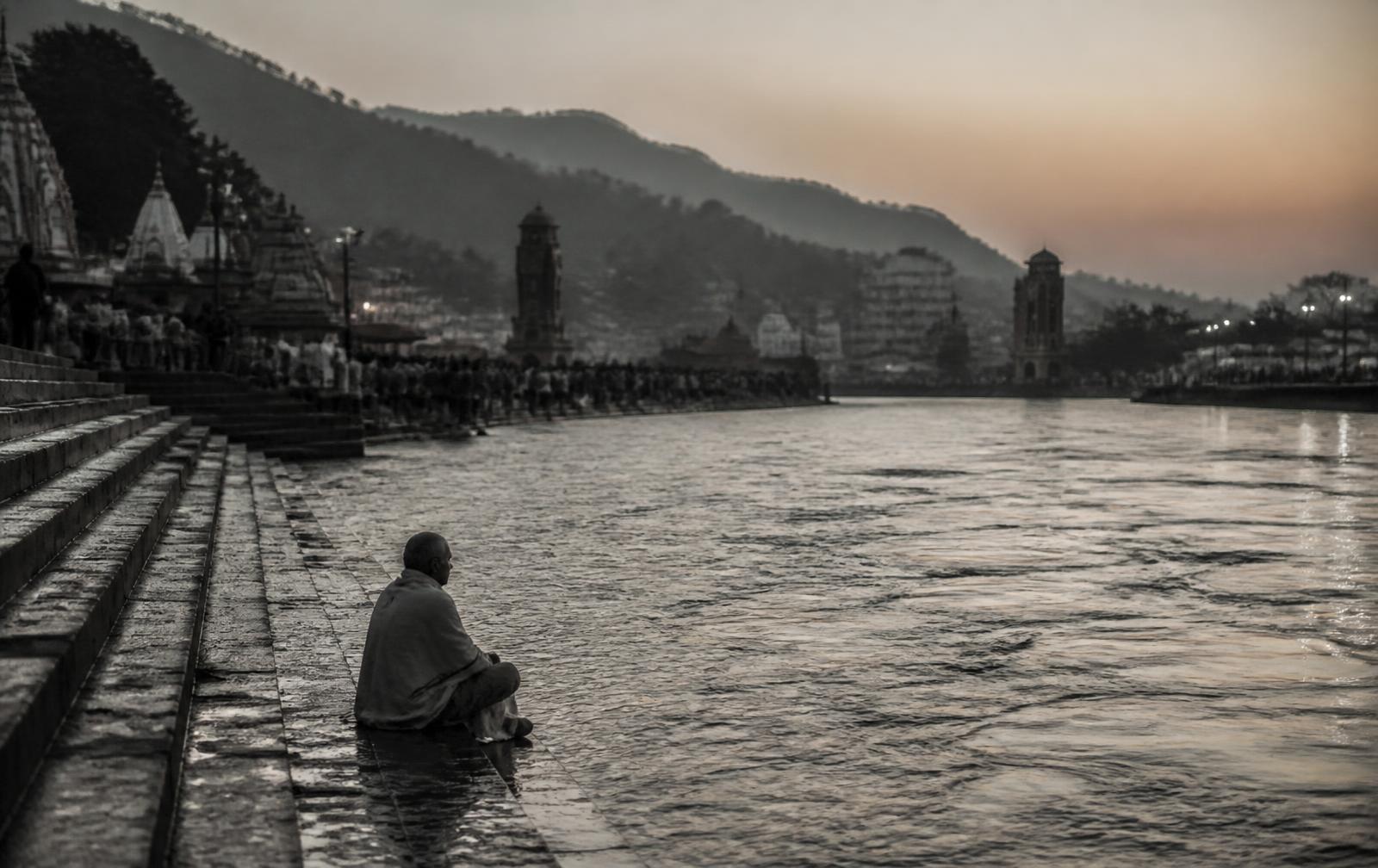 The Ganga flowing past the wide stone ghats of Haridwar at first light